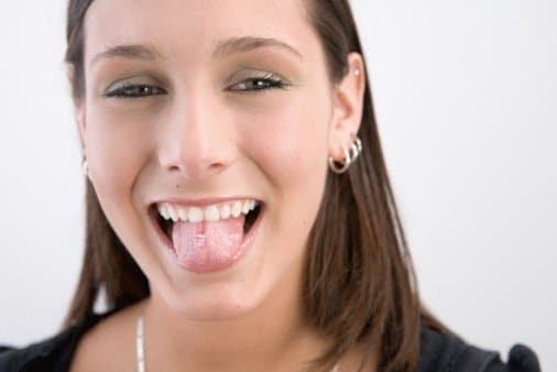 Woman with pierced tongue