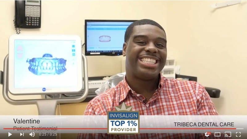 young man smiling after Invisalign treatment